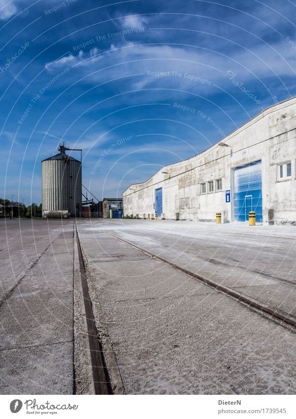 silo Outskirts Deserted Industrial plant Manmade structures Building Architecture Wall (barrier) Wall (building) Facade Blue Black White Silo Railroad tracks