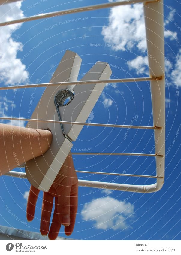 handcuffs Colour photo Exterior shot Close-up Detail Day Sunlight Worm's-eye view Arm Hand Fingers 1 Human being Sky Summer Beautiful weather Clothing Hang