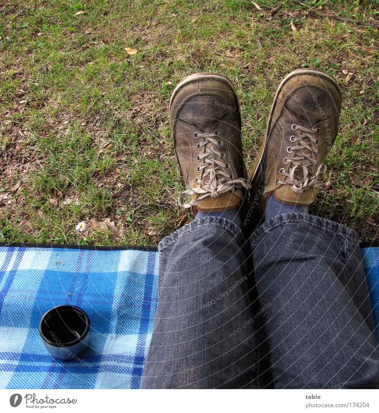 picnic Colour photo Nutrition Beverage Hot drink Coffee Mug Lifestyle Joy Leisure and hobbies Trip Man Adults Legs Feet Grass Meadow Jeans Footwear Relaxation