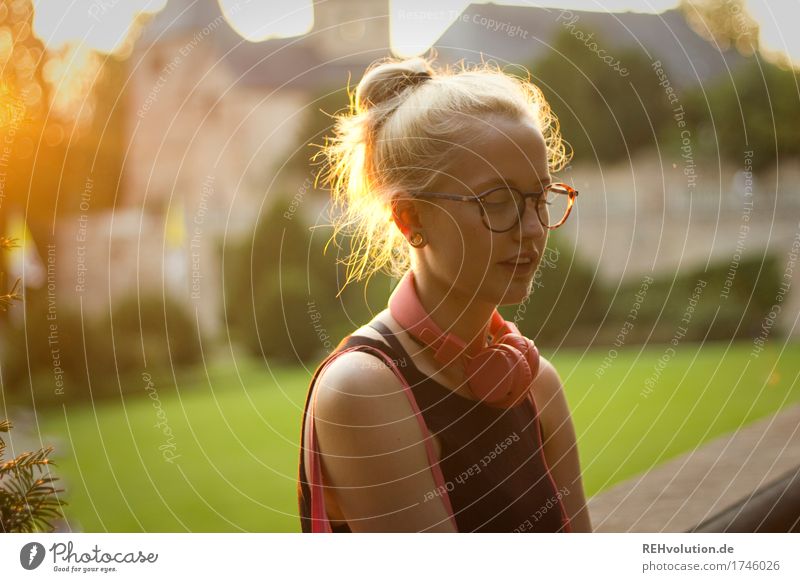Alexa - Young woman in the city with headphones and glasses at the golden hour Youth (Young adults) Woman Listen to music Sunlight portrait Back-light Day
