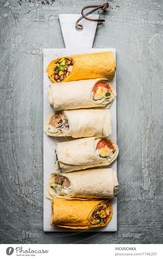 Various vegetarian tortilla wraps Food Fish Seafood Vegetable Lettuce Salad Bread Nutrition Lunch Banquet Organic produce Vegetarian diet Style Healthy Eating