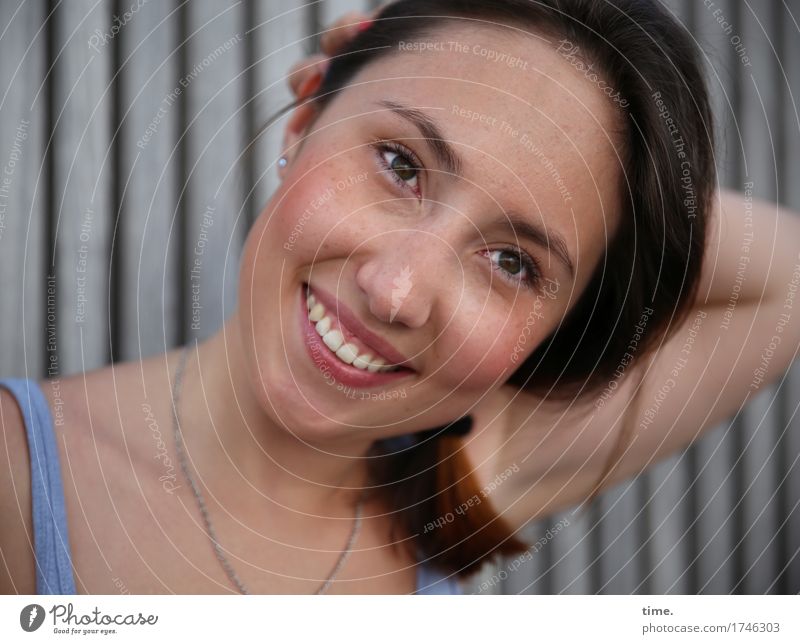 . Feminine 1 Human being Wall (barrier) Wall (building) T-shirt Jewellery Necklace Brunette Long-haired Observe Laughter Looking Friendliness Happiness Natural