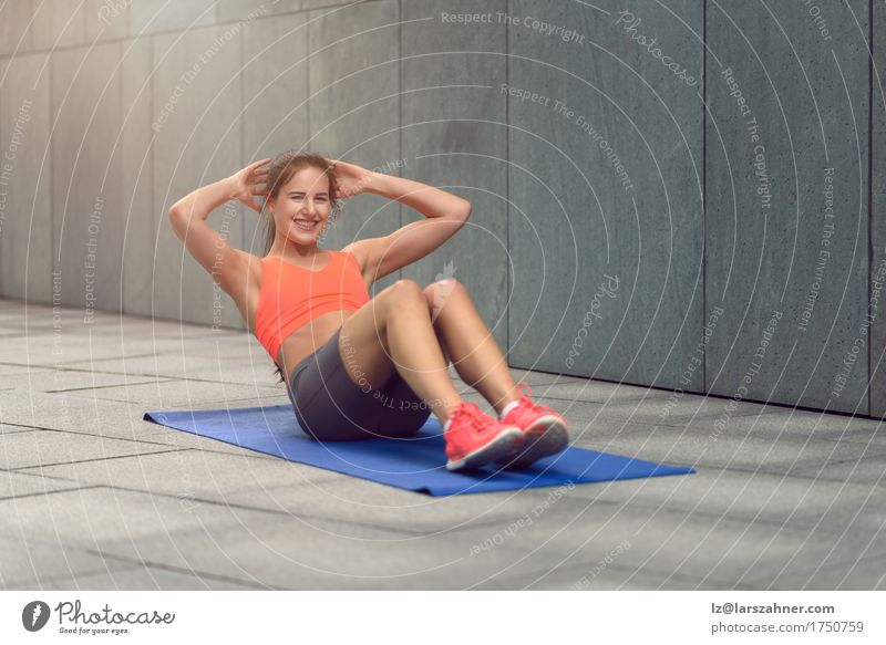 Athletic young woman doing stretching exercises - a Royalty Free Stock  Photo from Photocase