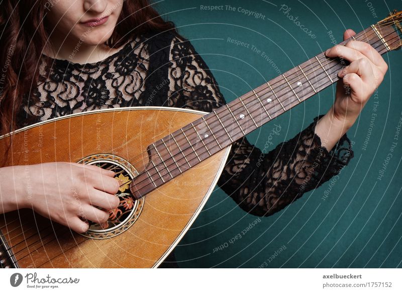 female playing lute string instrument Lifestyle Playing Entertainment Music Human being Feminine Young woman Youth (Young adults) Woman Adults 1 18 - 30 years