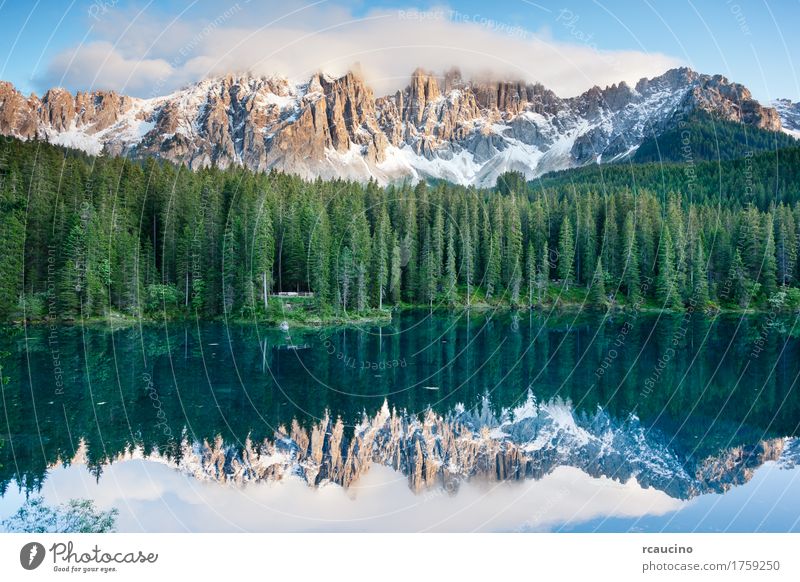 Karersee (Lago di Carezza), lake in the Dolomites, Italy. Vacation & Travel Summer Snow Mountain Landscape Sky Tree Forest Alps Lake Blue Green dolomitic Dusk