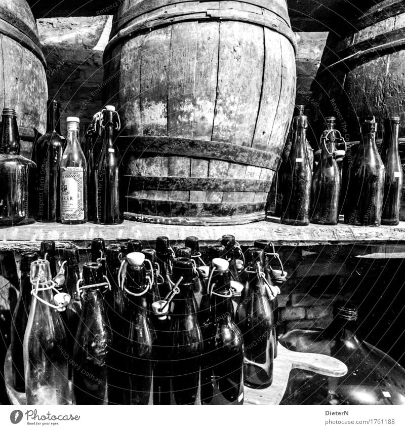 bottle deposit Wood Glass Gray Black White Keg Bottle Old Cellar arch Wine cask Bottle of beer Shelves wooden barrel Derelict Black & white photo Interior shot