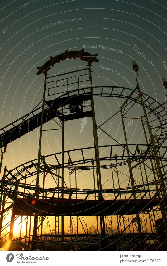 helter skelter Copy Space top Twilight Amusement Park Roller coaster Theme-park rides Sunrise Sunset Driving Speed Yellow Gold Red Joy Happy Happiness