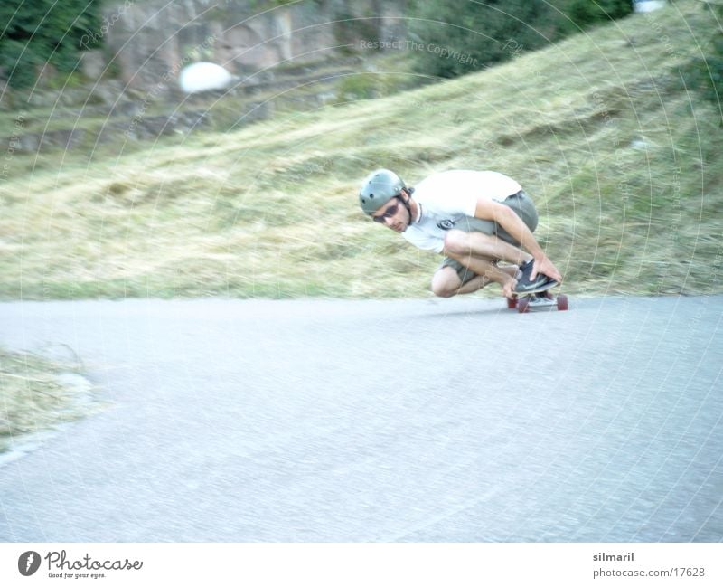 In action II Leisure and hobbies Sports Jeans Helmet Cool (slang) Speed Skateboarding Action Asphalt longboard fun Coil Colour photo
