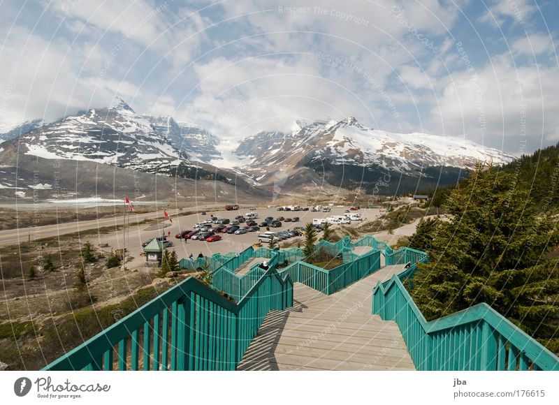 Icefield Center Colour photo Exterior shot Day Sunlight Vacation & Travel Tourism Far-off places Summer Air Sky Clouds Mountain Rocky Mountains Icefield parkway