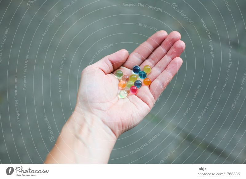 coloured glibber balls Lifestyle Leisure and hobbies Playing Marble Hand Palm of the hand 1 Human being Sphere To hold on Round Multicoloured Infancy Mixed