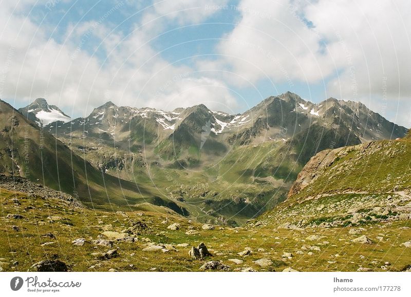 under the clouds Colour photo Exterior shot Deserted Day Sunlight Deep depth of field Nature Landscape Earth Air Sky Clouds Summer Hill Mountain Peak Stone