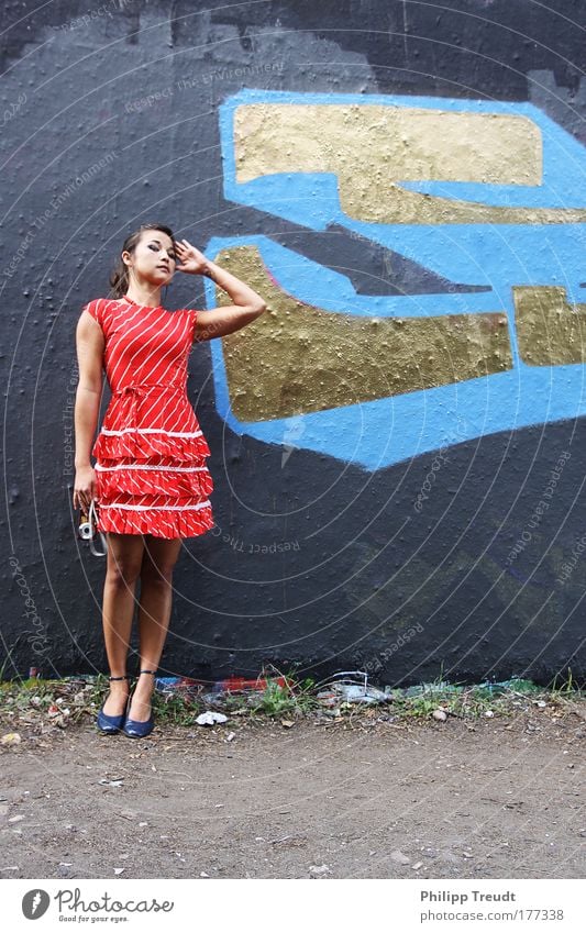 Girl meets Wall Multicoloured Exterior shot Copy Space right Copy Space bottom Day Sunlight Deep depth of field Central perspective Full-length Looking away