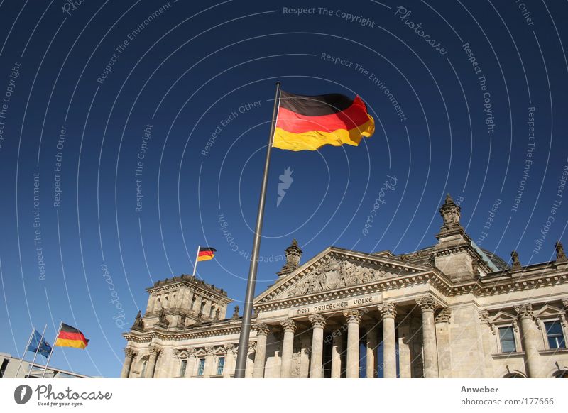 Reichstag in Berlin with flags Colour photo Multicoloured Exterior shot Deserted Copy Space left Copy Space top Neutral Background Day Sunlight Worm's-eye view
