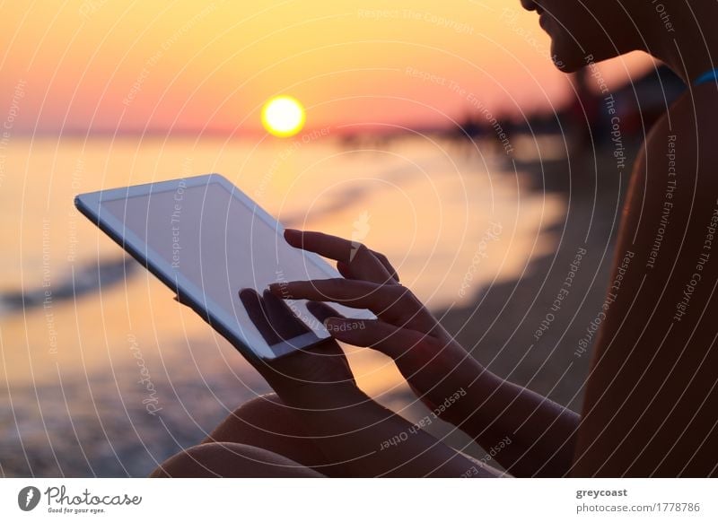 Close-up shot ofwoman working with tablet computer on sunset and sea background Vacation & Travel Summer Sun Beach Ocean Computer Human being Girl Young woman