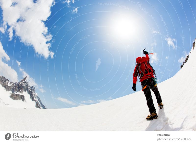 A mountaineer expresses his joy reaching the summit Joy Adventure Expedition Winter Snow Mountain Sports Climbing Mountaineering Success Man Adults Nature