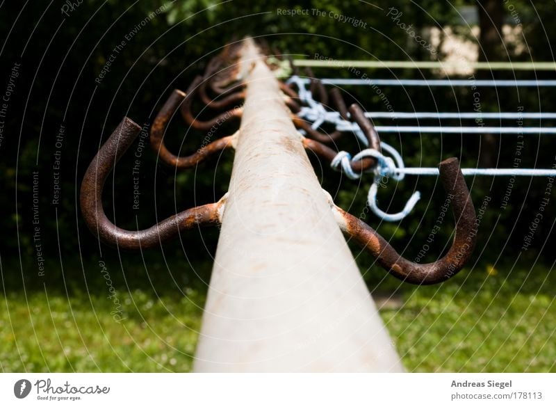 leash Colour photo Exterior shot Detail Deserted Day Garden Meadow clothes pole Clothesline Checkmark Metal Line Old Trashy Gloomy Blue Brown Gray Green