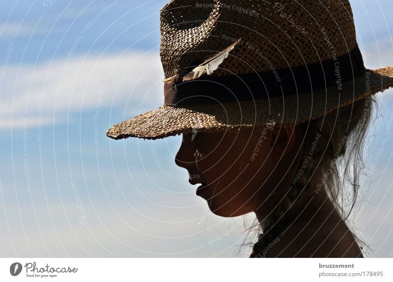 Feather in my hat Colour photo Exterior shot Copy Space left Day Shadow Back-light Downward Looking away Human being Child Girl Infancy Head Hair and hairstyles