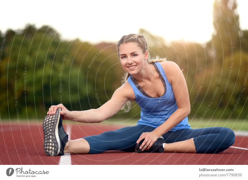Happy fit young woman doing stretching exercises Lifestyle Beautiful Face Summer Sports Feminine Woman Adults 1 Human being 18 - 30 years Youth (Young adults)