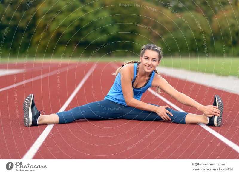 Athletic young woman doing stretching exercises - a Royalty Free Stock  Photo from Photocase