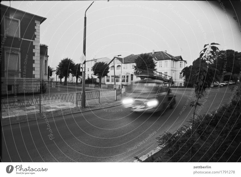 Kühlungsborn, 1985 Street Transport Car Blur Speed Haste barkas Evening Twilight Deserted Gloomy Crossroads Road junction Town Small Town Black & white photo