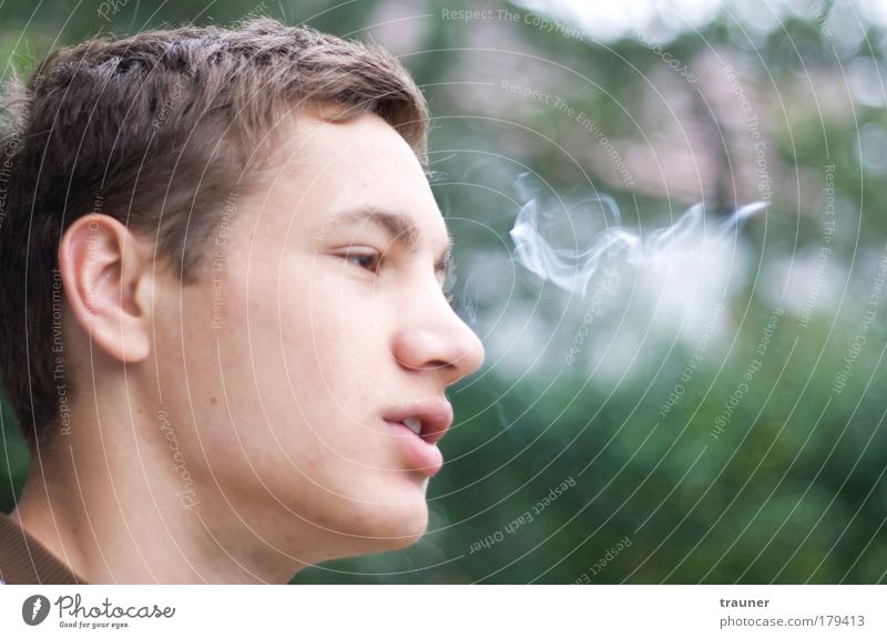Watching the smoke dissolving in the air Colour photo Exterior shot Day Contrast Silhouette Motion blur Shallow depth of field Portrait photograph Forward