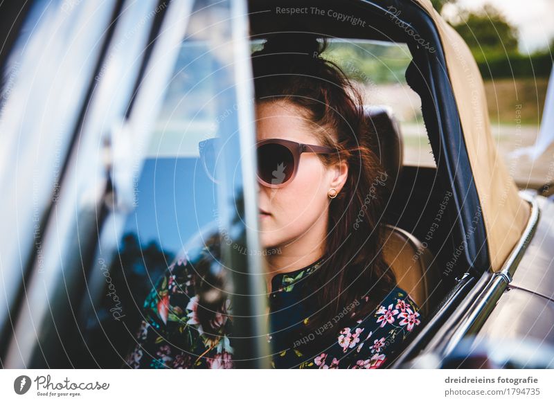 Retro girl. Lifestyle Style Feminine Young woman Youth (Young adults) Motoring Vehicle Car Vintage car Sports car Sunglasses Brunette Driving Looking Sit