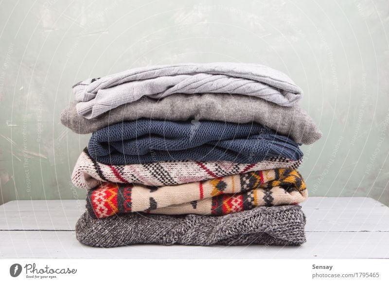 warm sweaters stacked on table Knit Winter Autumn Warmth Fashion Clothing Sweater Wood Soft White Comfortable Stack Wool knitwear fall Accumulation Cupboard