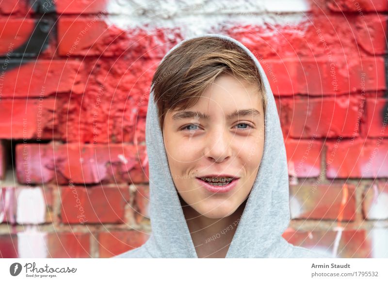 Portrait of a smiling teenager with hoodie Lifestyle Style Design already Harmonious Well-being Contentment Human being Masculine Young man Youth (Young adults)