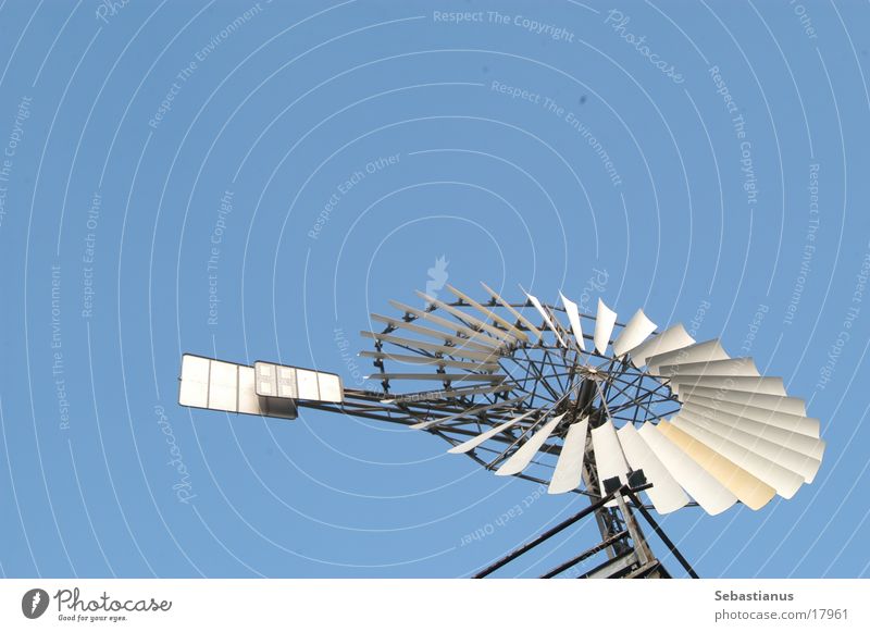 Windmill in the sky Sky Pinwheel Isolated Image Object photography Copy Space top Bright background Bucket wheel Movement Rotate Rotation Circular Thorough