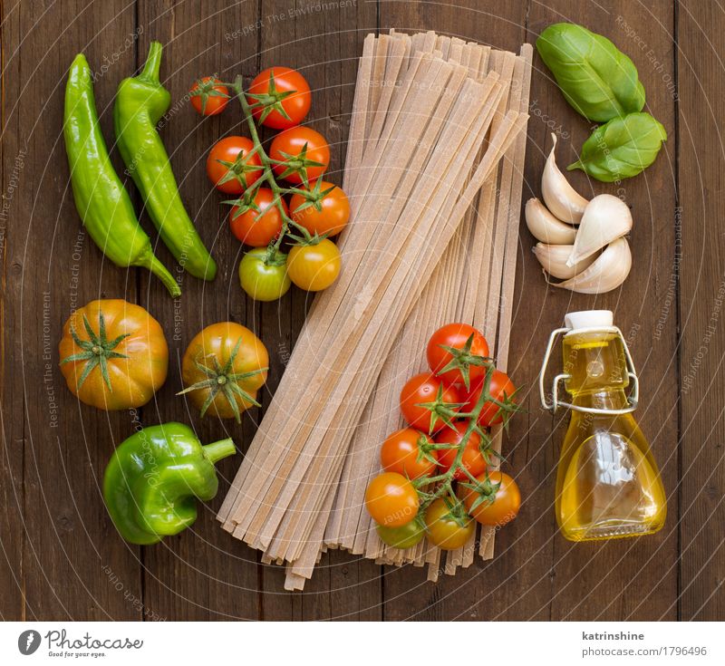 Raw fettucce pasta, vegetables and olive oil Vegetable Dough Baked goods Herbs and spices Vegetarian diet Diet Bottle Dark Fresh Brown Green Red Tradition Basil