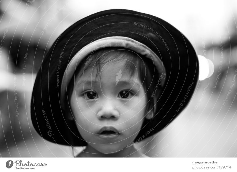 children of this world Black & white photo Exterior shot Day Contrast Shallow depth of field Portrait photograph Looking into the camera Skin Face Human being