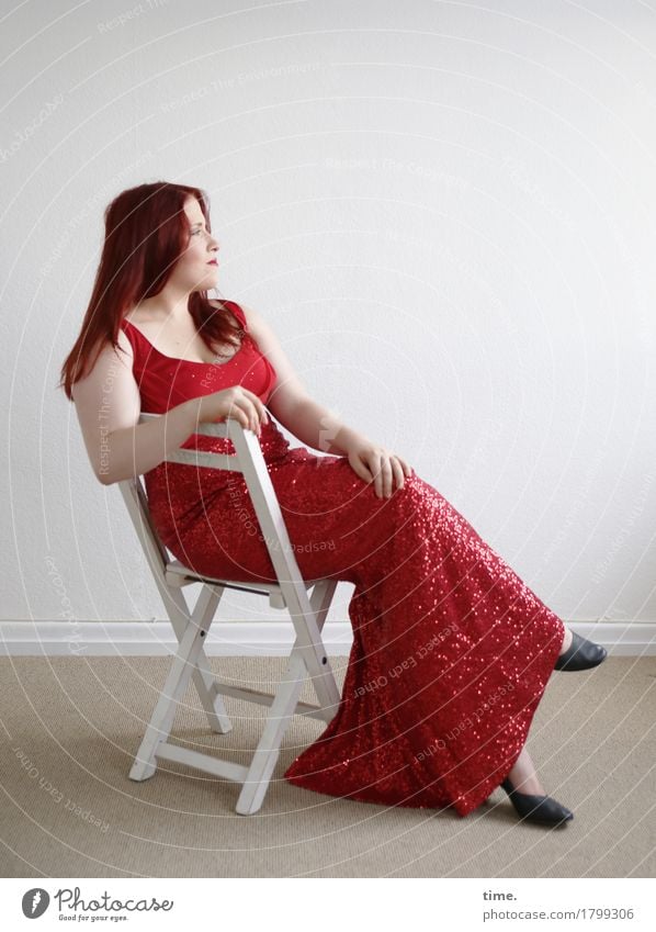 . Chair Room Feminine 1 Human being Dress Red-haired Long-haired Observe Think Looking Sit Wait Elegant Beautiful Contentment Self-confident Cool (slang)