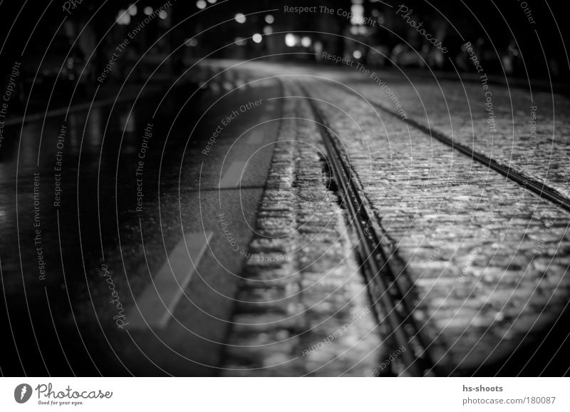 Railways and roads Black & white photo Night Worm's-eye view Rain Freiburg im Breisgau Germany Town Transport Means of transport Traffic infrastructure Street