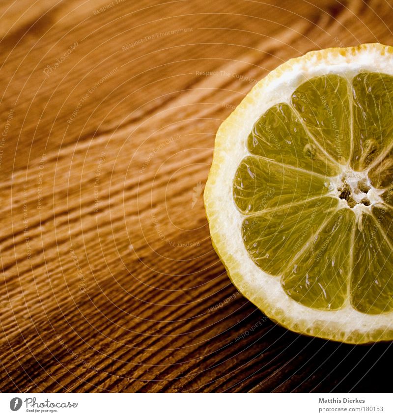 lemon Lemon Ingredients Fruit Citrus fruits Fruit flesh Yellow Sour Wooden board Healthy Vitamin C Nutrition Sense of taste Effort Delicious Juice Cut Half