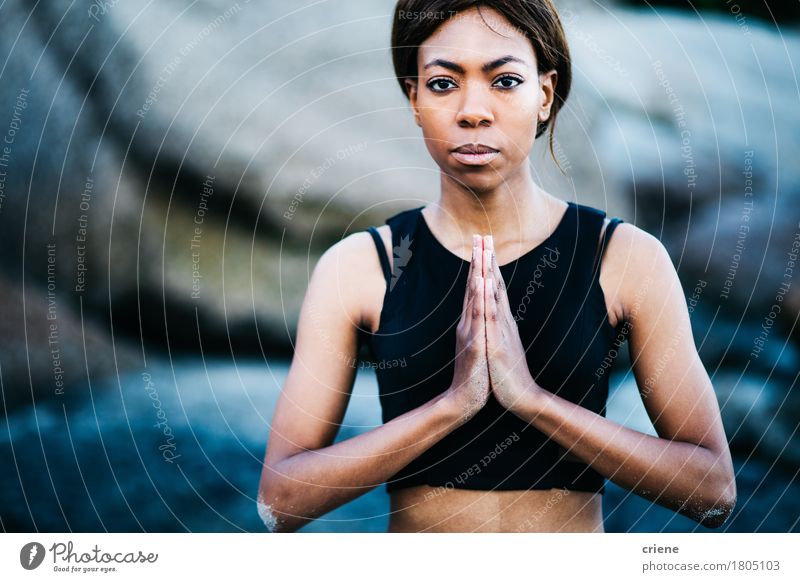 African young woman doing namaste yoga pose Lifestyle Body Leisure and hobbies Human being Feminine Young woman Youth (Young adults) 1 18 - 30 years Adults