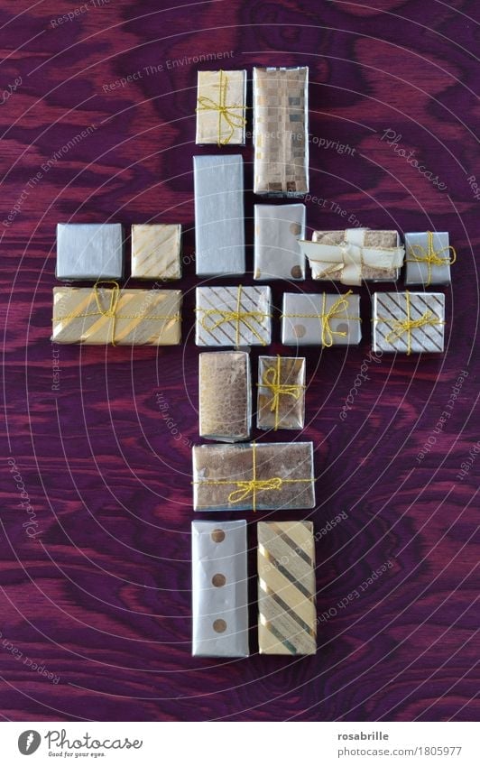 Good Friday gift - many small gifts together form a cross on a purple wooden background Easter fasting Packaging Decoration Bow Gift Sign Crucifix