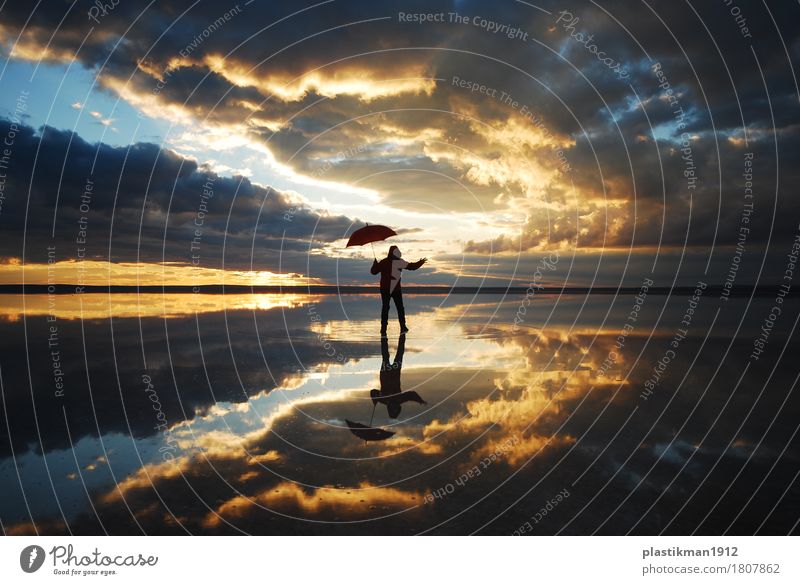 dancing on the lake Human being Man Adults Body 1 Nature Water Sky Clouds Horizon Beautiful weather Lake Fresh Healthy Dance Umbrella Reflection Red Silhouette
