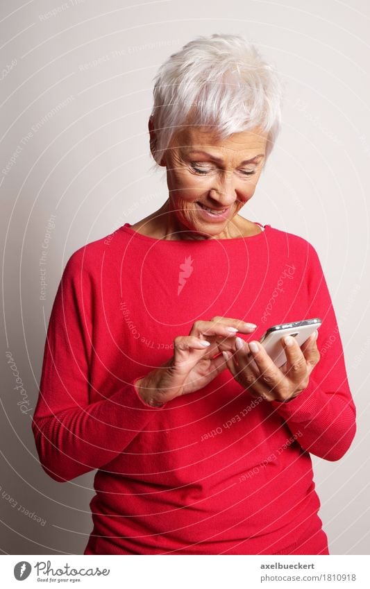 senior woman using smartphone Lifestyle Telephone Cellphone PDA Technology Telecommunications Internet Human being Woman Adults Female senior Grandmother