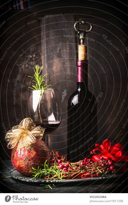 Red wine with festive Christmas decoration Banquet Beverage Drinking Wine Bottle Glass Luxury Style Design Joy Winter Living or residing Interior design