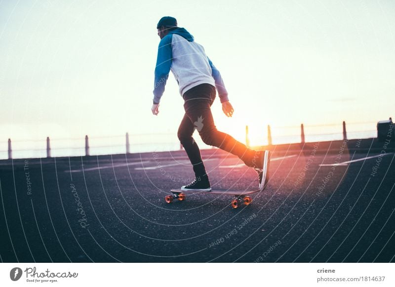 Hipster boy rolling with long board on promenade in sunset Lifestyle Relaxation Leisure and hobbies Sports Human being Young man Youth (Young adults) Man Adults