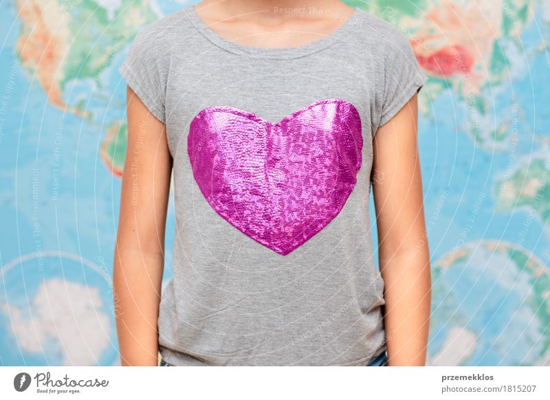 Girl with heart shape on t-shirt with map in the background 1 Human being 13 - 18 years Youth (Young adults) T-shirt Heart Globe Love Free Friendliness