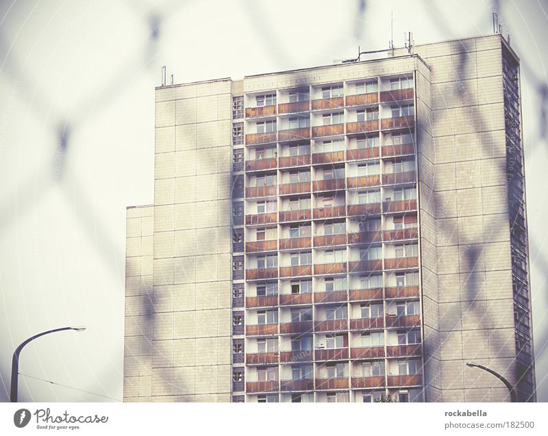 High-rise view through wire mesh fence Subdued colour Exterior shot Day Town House (Residential Structure) Building Architecture Wall (barrier) Wall (building)