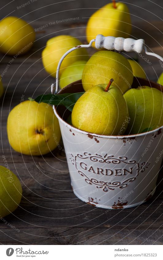 Ripe yellow pears in a metal bucket on a wooden table Food Fruit Dessert Nutrition Eating Vegetarian diet Diet Crockery Health care Summer Table Nature Autumn