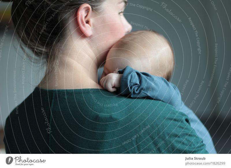 Young mother with sleeping baby in her arms Feminine Baby Woman Adults Mother 2 Human being 0 - 12 months 30 - 45 years Brunette Sleep Cuddly Warmth Blue Green