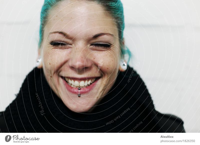 Portrait of a laughing young woman with turquoise hair Lifestyle Joy already Young woman Youth (Young adults) Face 18 - 30 years Adults peel Piercing Earring