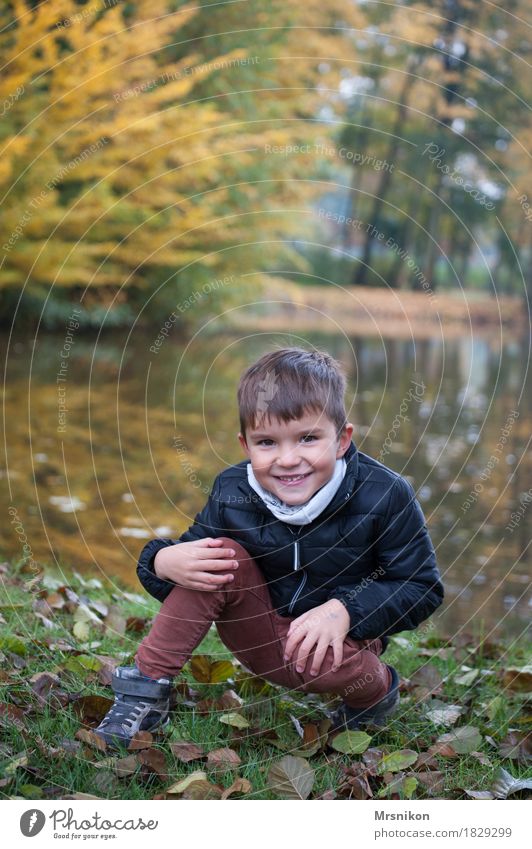 At the lake Joy Human being Toddler Boy (child) Family & Relations Infancy 1 3 - 8 years Child Crouch Smiling Laughter Looking Autumn Autumnal Leaf Lakeside