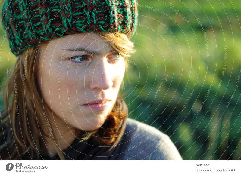 There'll be trouble. Woman Human being Youth (Young adults) Freckles Cap Woolen hat Red-haired Autumn Portrait photograph Close-up Evil Anger Sour Looking away