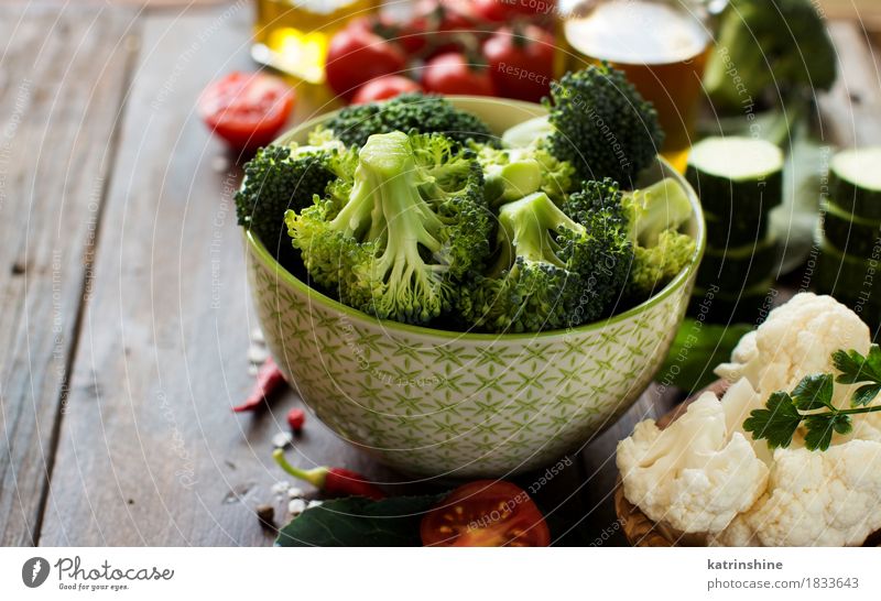 Fresh green broccoli and vegetables Food Vegetable Herbs and spices Cooking oil Nutrition Eating Vegetarian diet Diet Bowl Table Autumn Leaf Dark Healthy