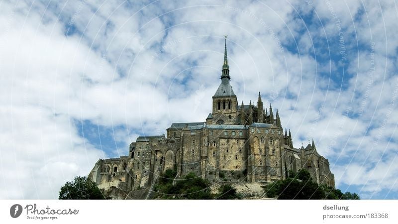 Mont-Saint-Michel in the background blue sky with white light clouds Colour photo Exterior shot Deserted Copy Space left Copy Space top Day Contrast Sunlight