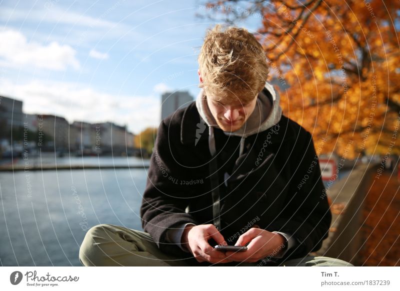 Man with phone Cellphone Human being Masculine Adults Family & Relations Youth (Young adults) Life 1 18 - 30 years Sky Uniqueness Autumn Berlin Spree